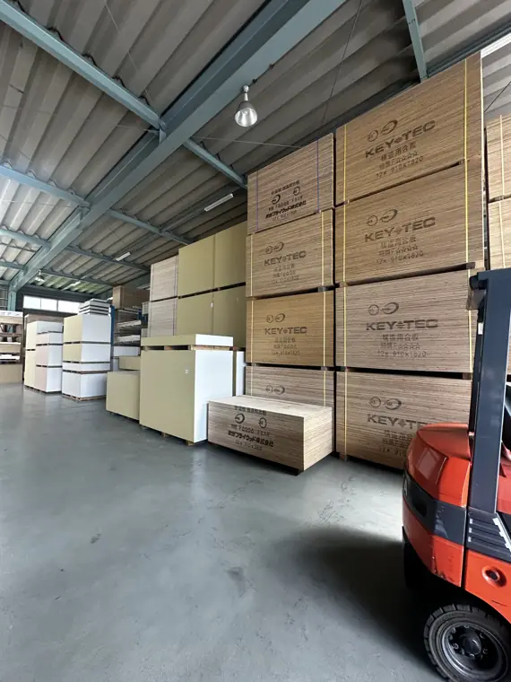 Forklift loading Japanese building material pallets inside the EST warehouse